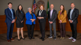 Vancouver City Councilmembers standing in council chambers